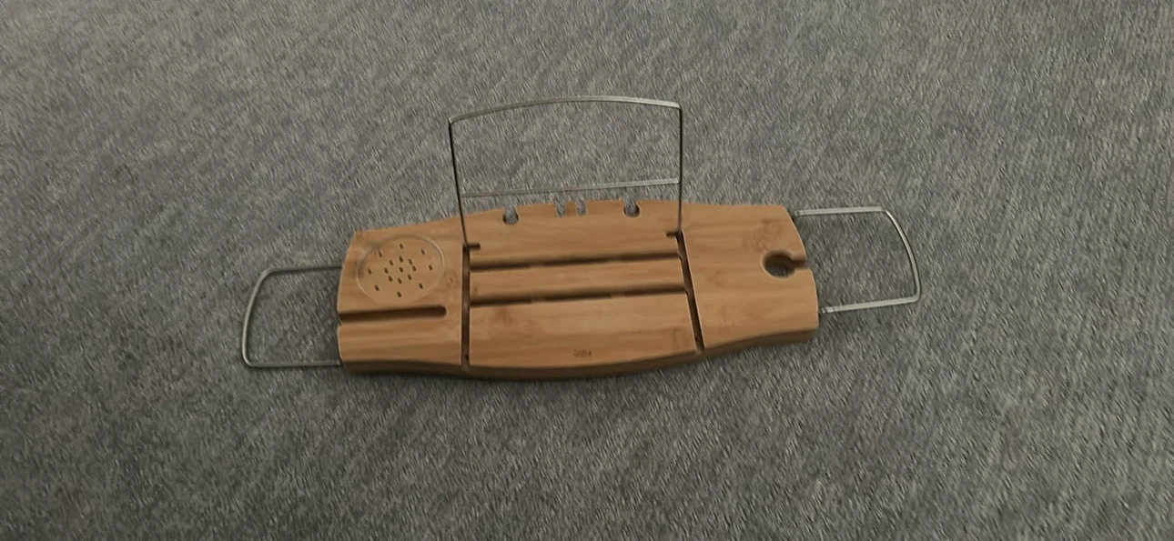 Umbra Aquala bamboo bath caddy with book and wine glass holder