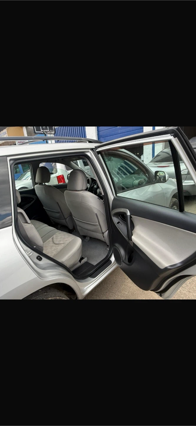 Silver Toyota RAV4 SUV - photo 4