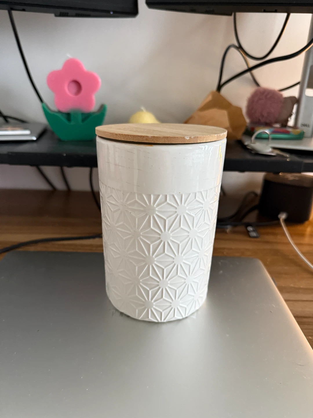 White ceramic jar with wooden lid