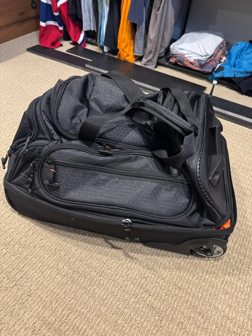 BRAND NEW! Black Rolling Duffle Bag carry on luggage