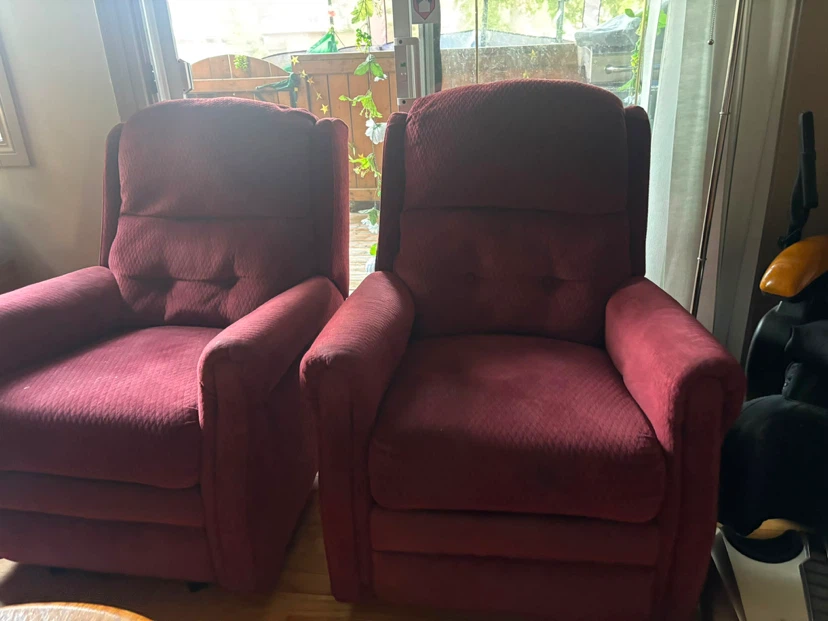 Two Burgundy Recliner Chairs