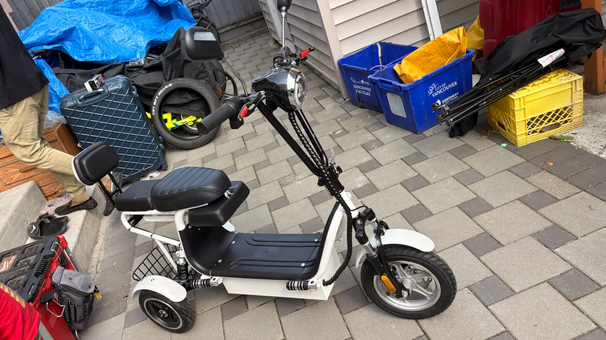 White Electric Scooter with Keys and Helmet