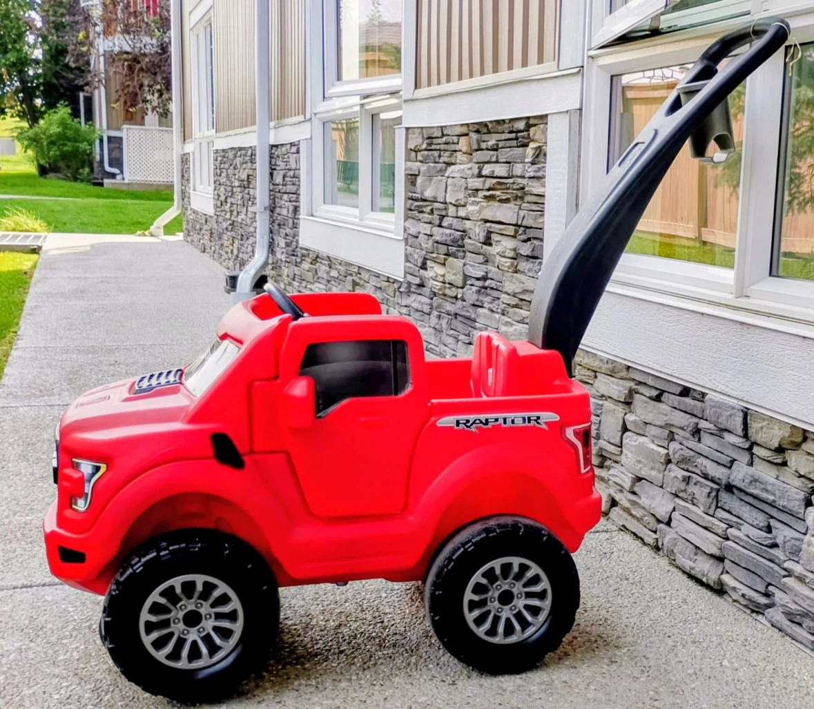 Red Ford Raptor Ride-On Toy Car with Push Handle