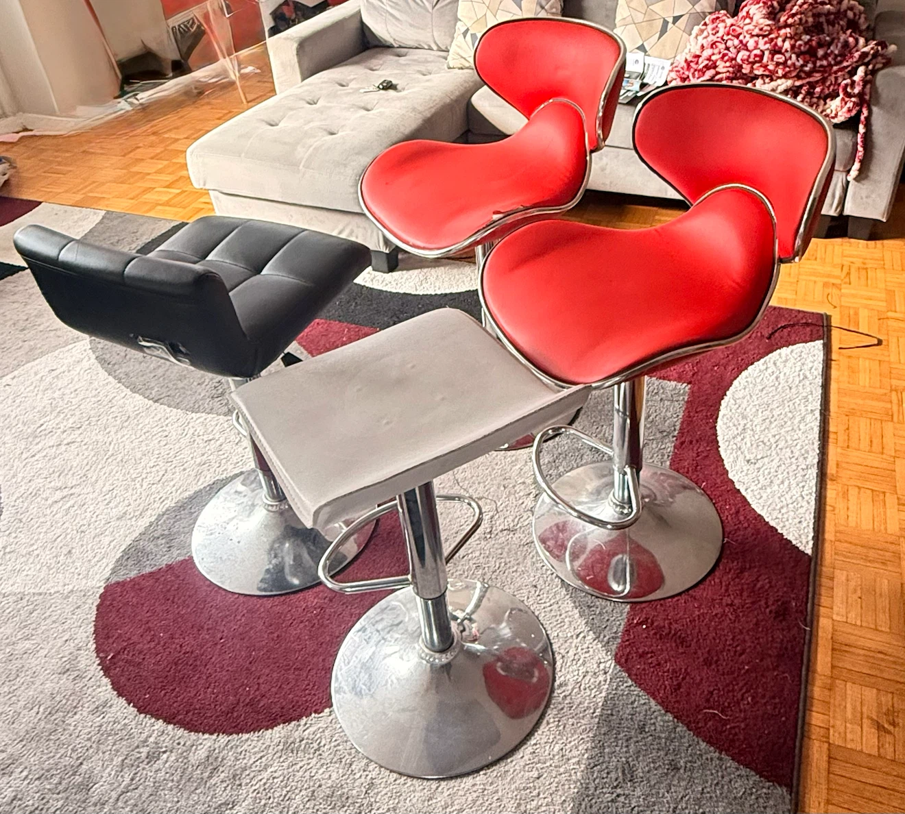 Set of 4 Bar Stools (2 Red, 1 Grey, 1 Black)