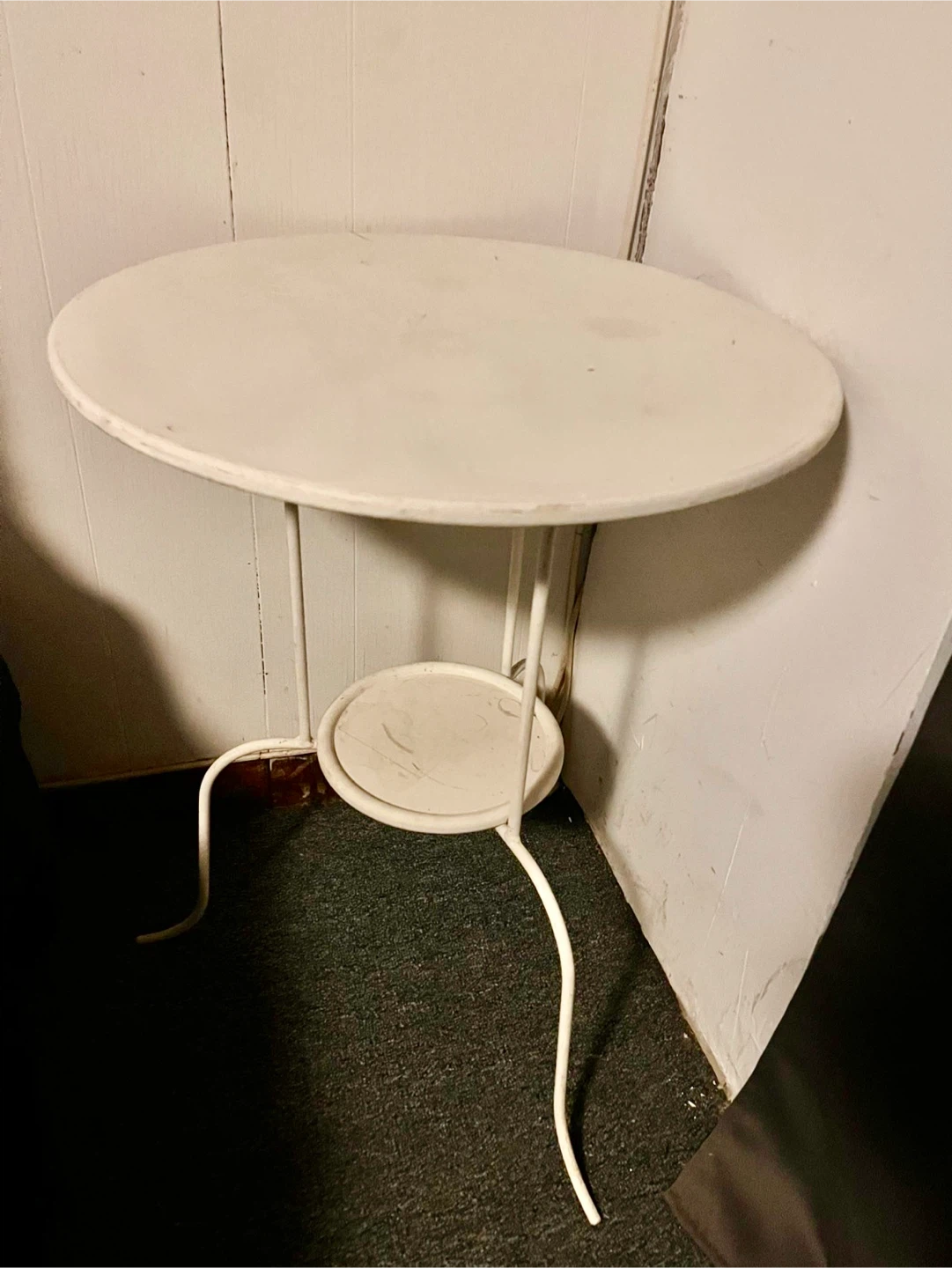 Round white metal side table