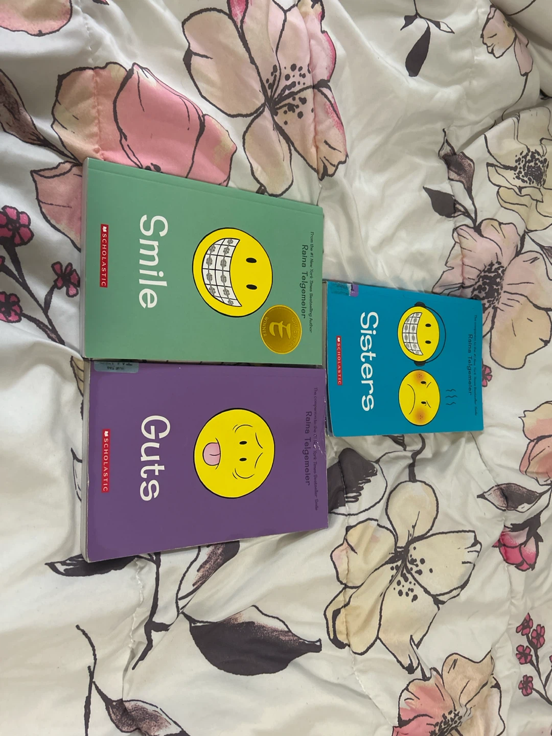 Raina Telgemeier graphic novels: Smile, Guts, Sisters