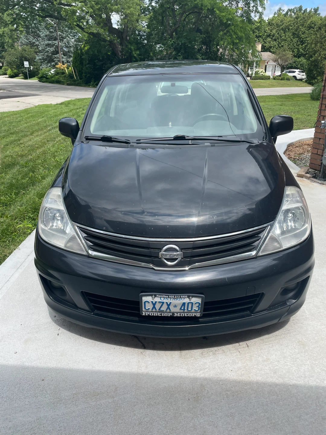 Black Nissan Versa SL Hatchback - photo 3