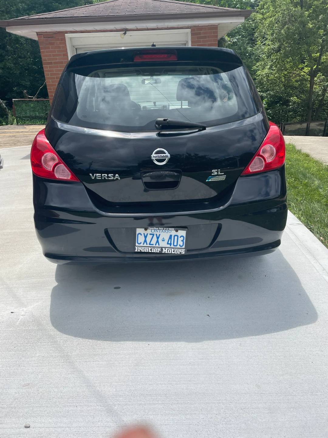 Black Nissan Versa SL Hatchback - photo 4