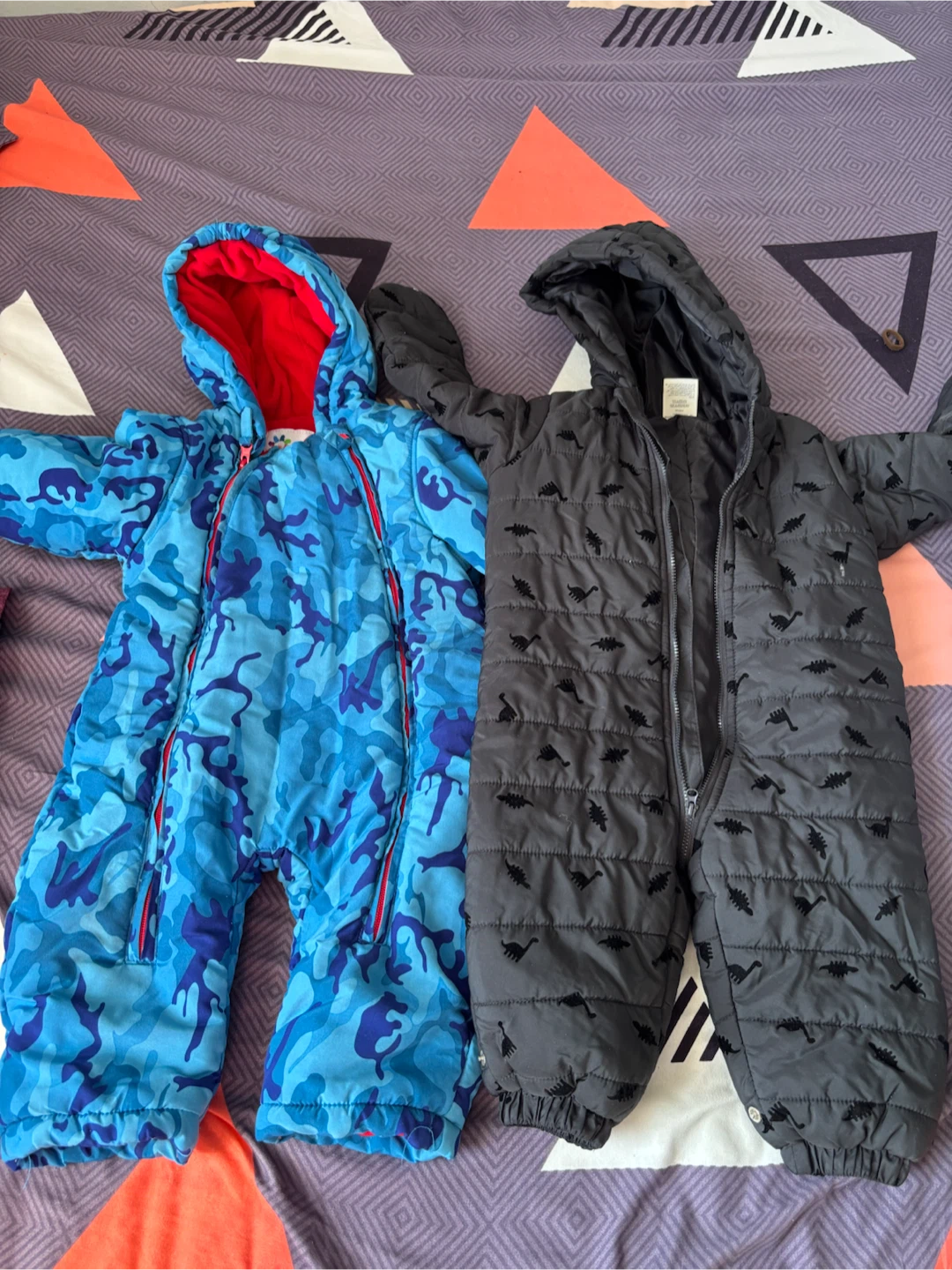 Two baby snowsuits and rompers