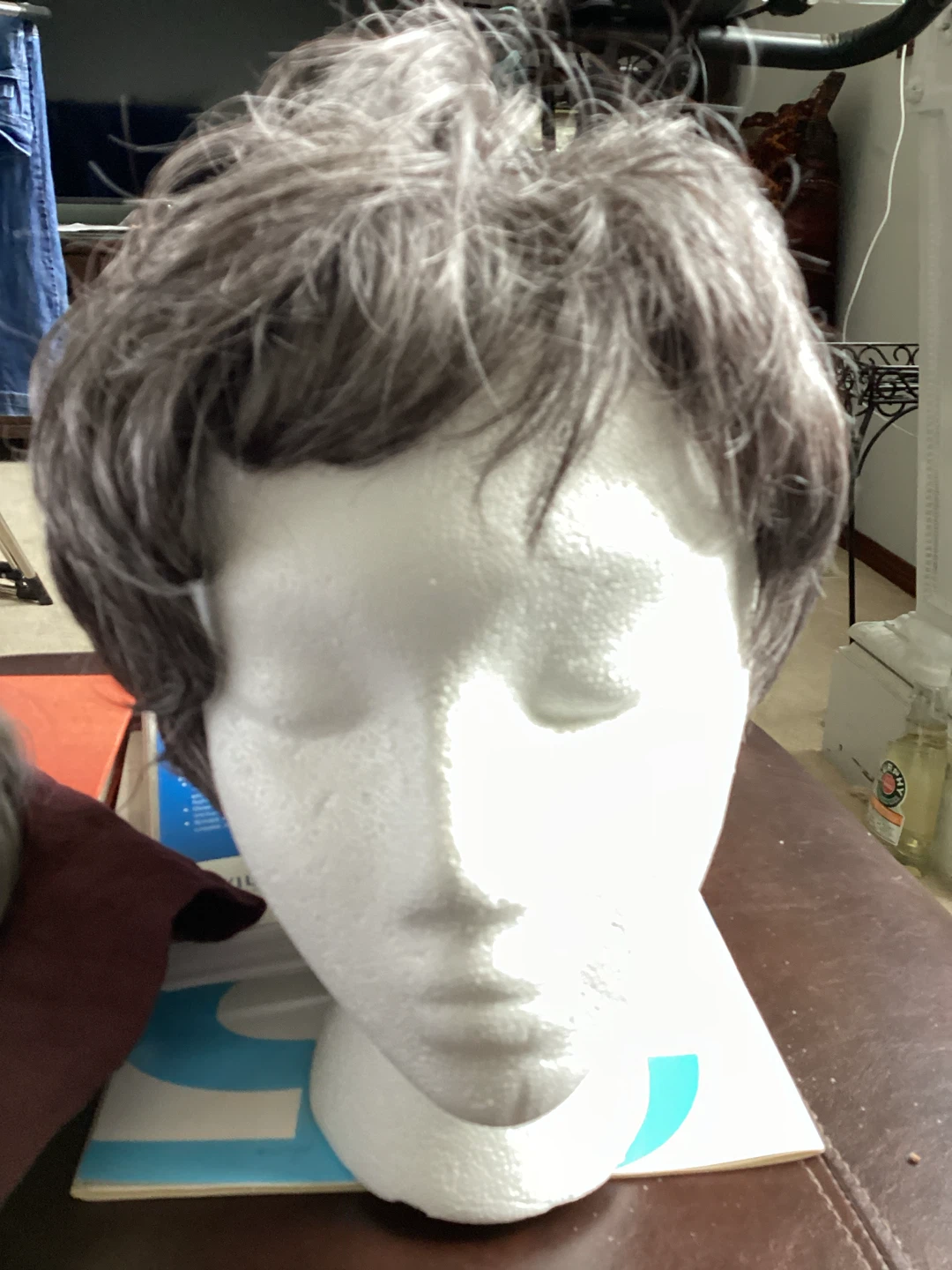 Wig with short, layered grey and dark brown hair