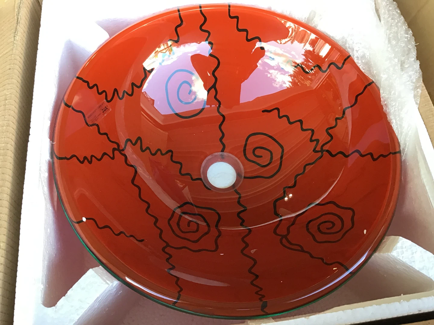Red Glass Vessel Sink with Black Swirl Design
