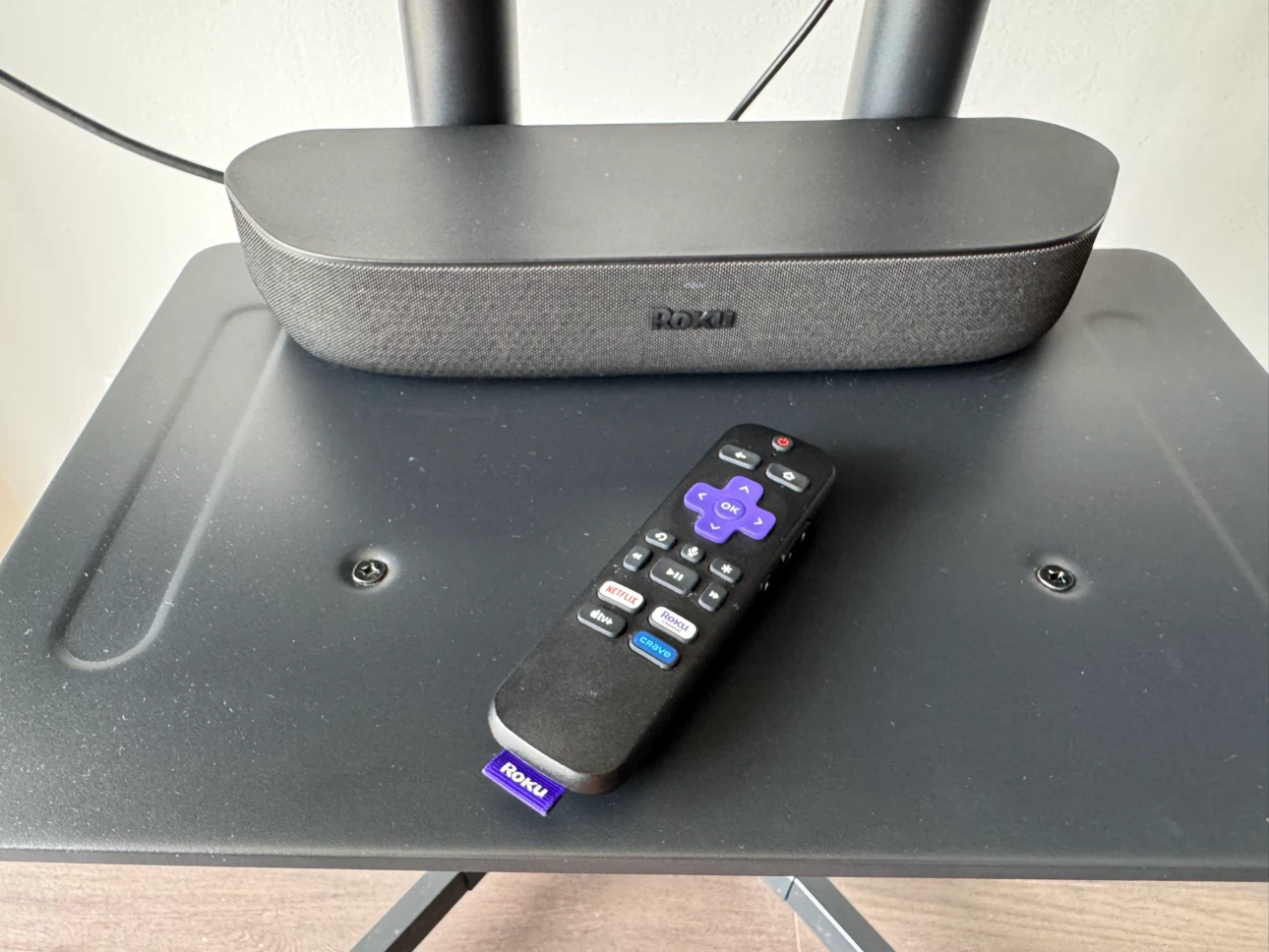 Roku LG TV on Rolling Stand with Soundbar and Remote - photo 2