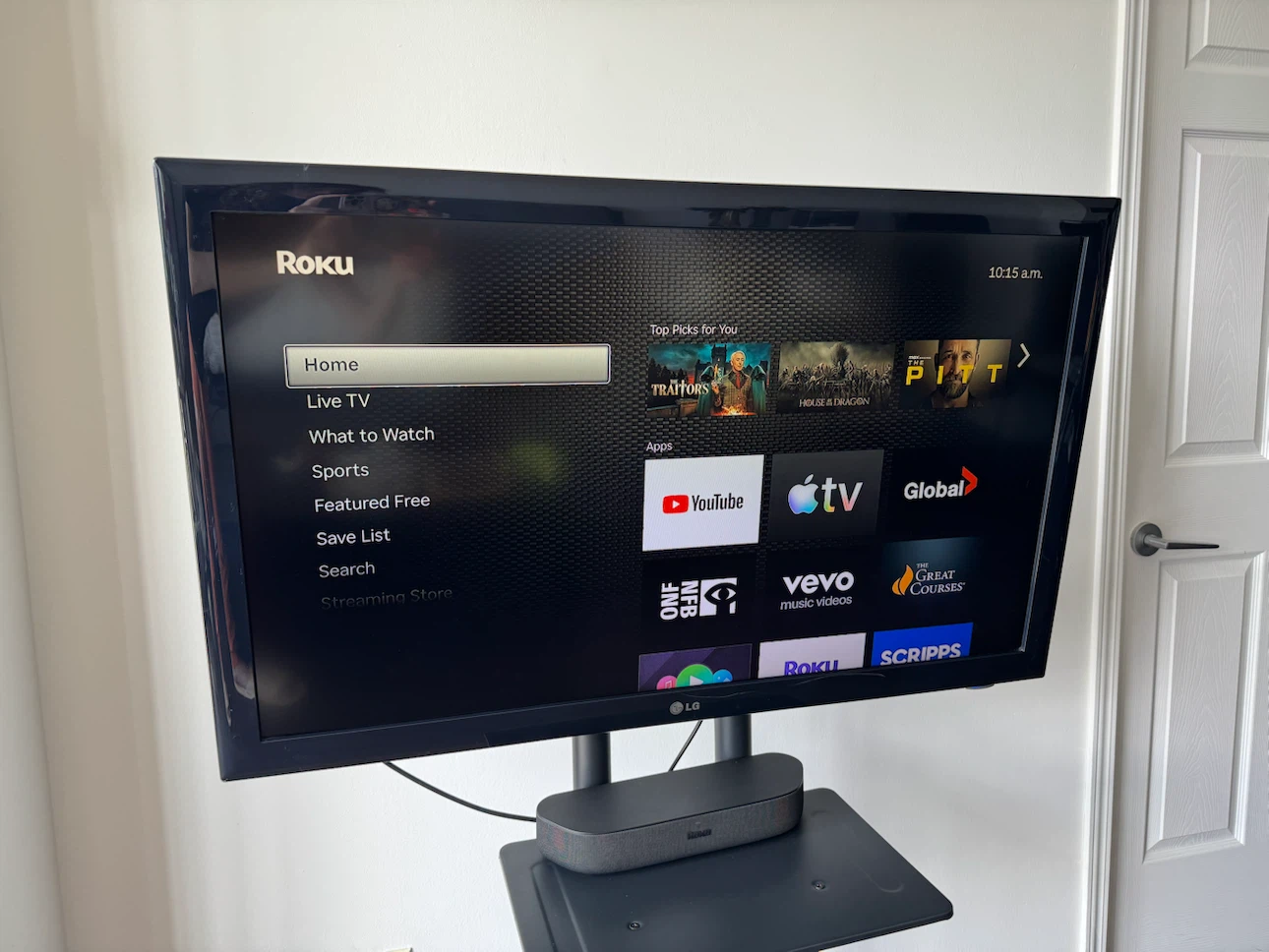 Roku LG TV on Rolling Stand with Soundbar and Remote - photo 3