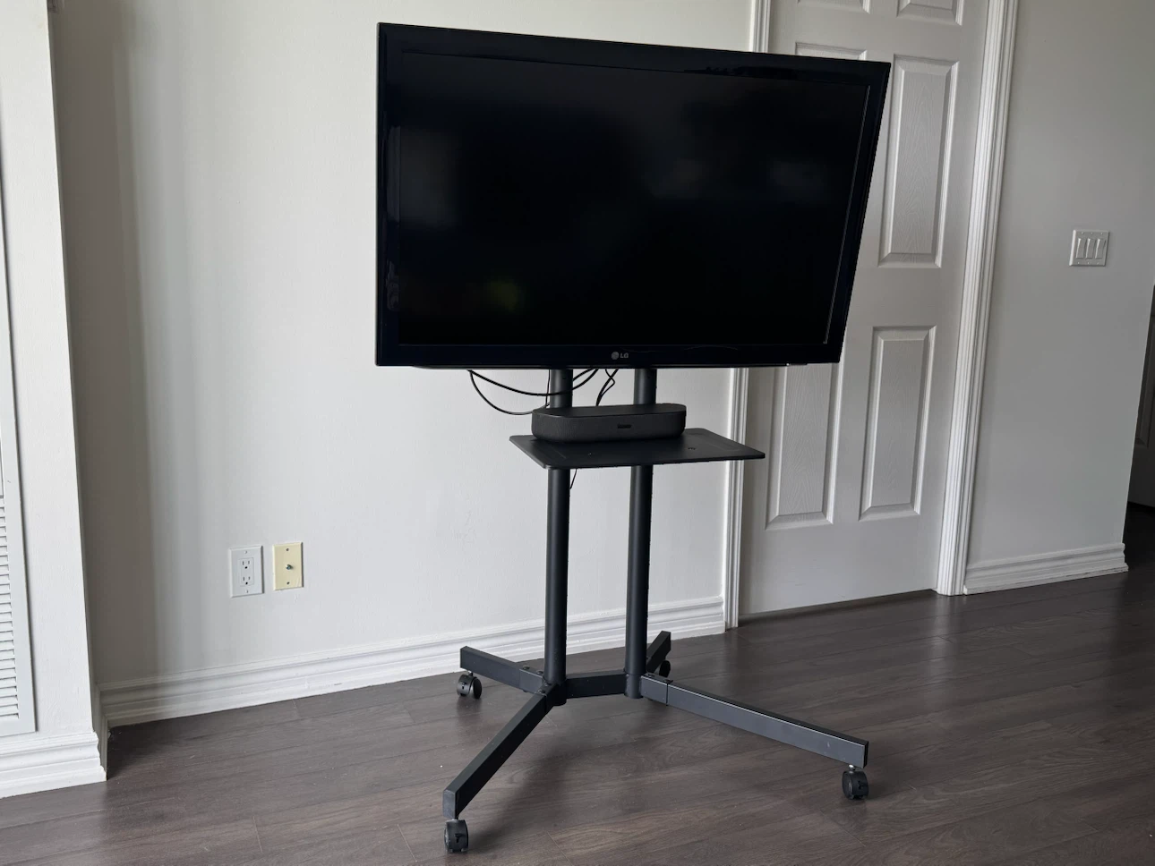 Roku LG TV on Rolling Stand with Soundbar and Remote - photo 5