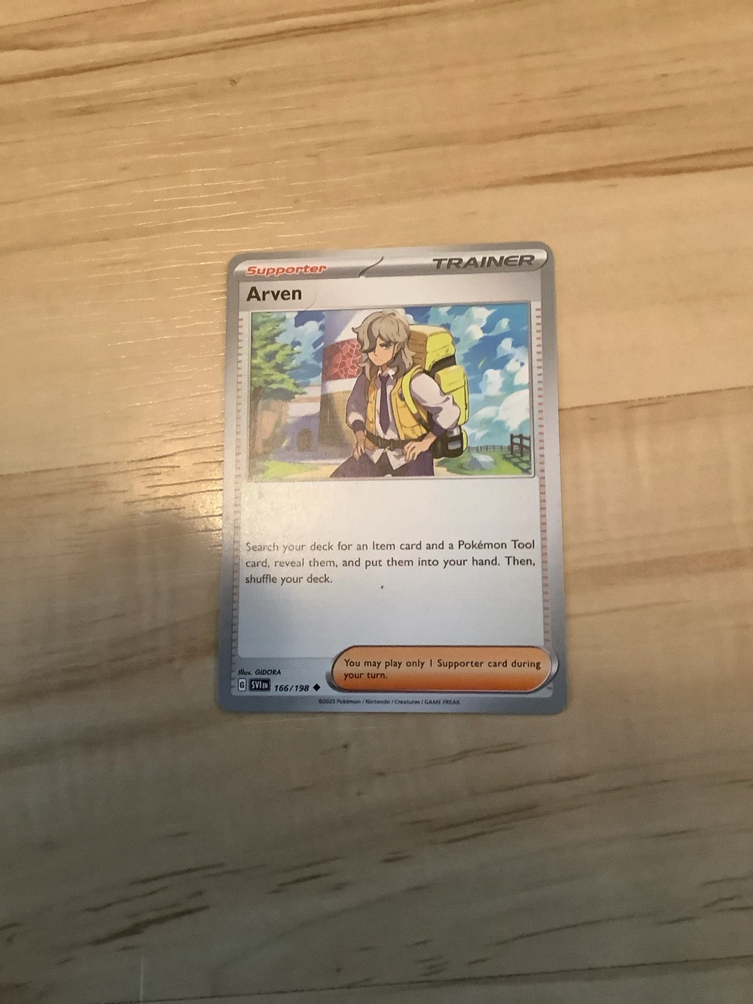Pokemon Arven Trainer Card (SV1EN 166/198)