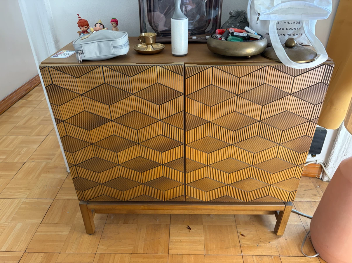 Wooden cabinet with geometric pattern
