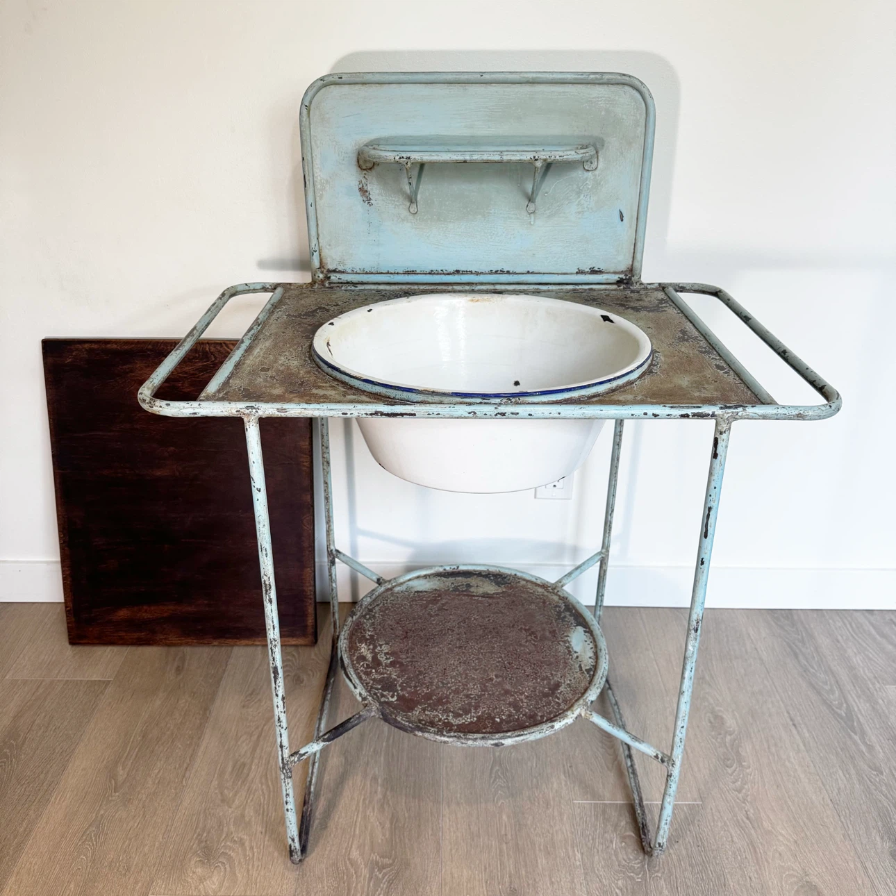 Antique metal washstand with enamel basin and removable wood top