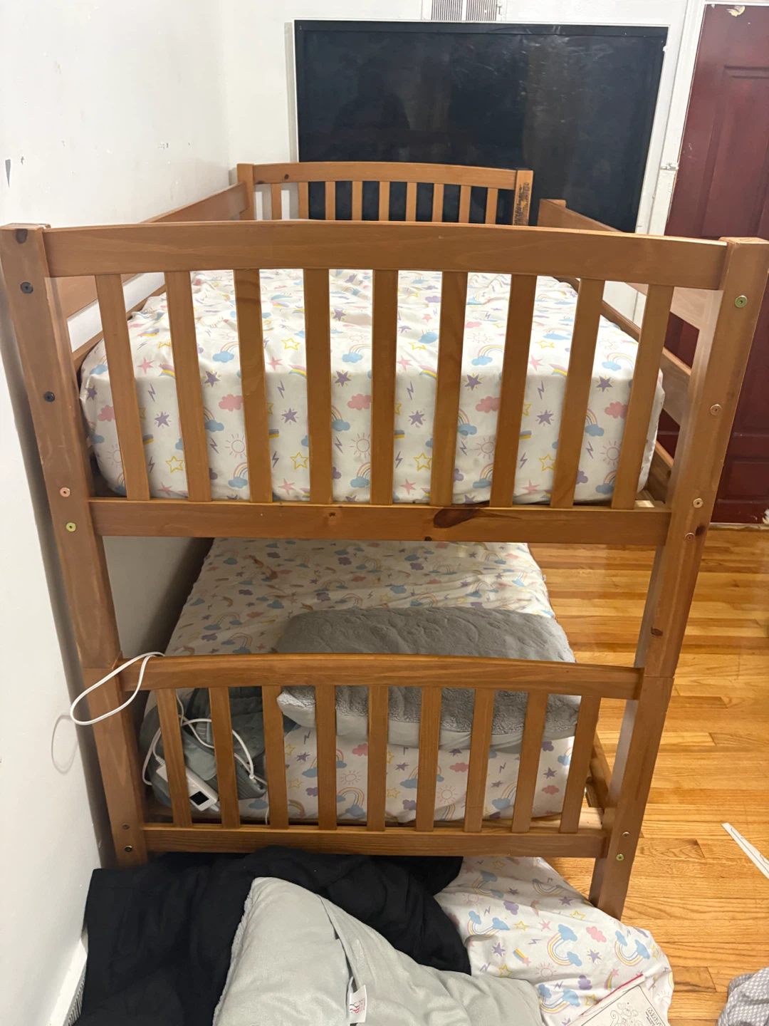 Wooden Bunk Bed with Rainbow Cloud Sheets