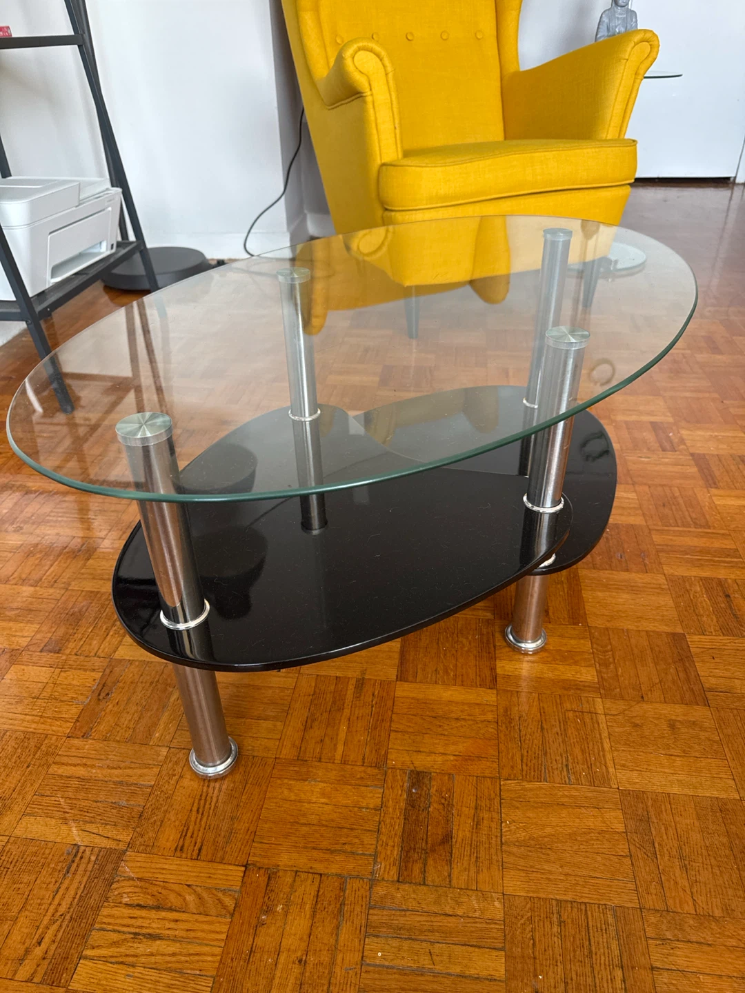 Oval Glass Coffee Table with Black Shelf