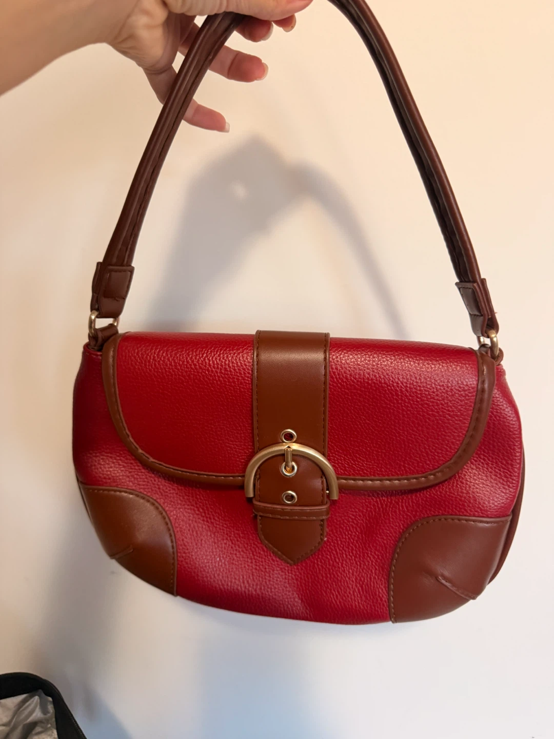 Red hand  bag with brown accents