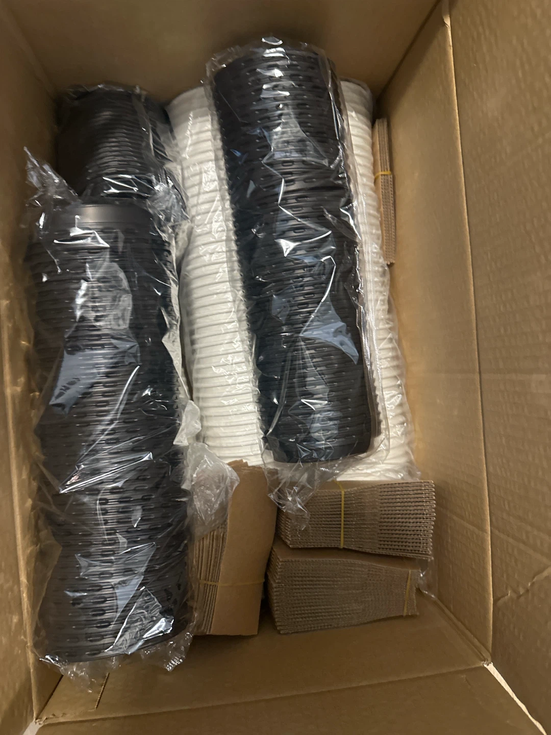Case of Black and White Disposable Cups with Lids