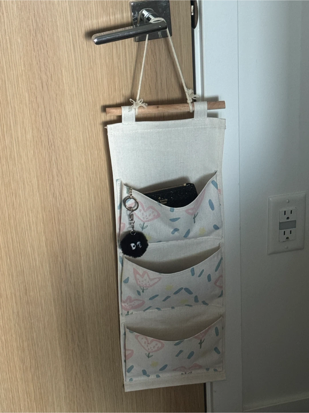 Cute fabric hanging wall organizer with wooden rod