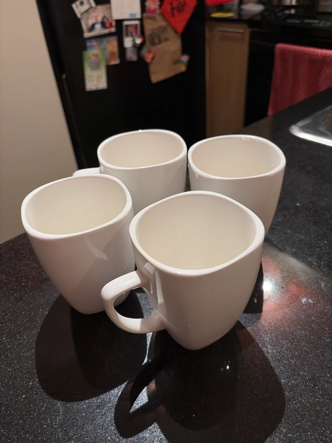 Set of 4 white ceramic mugs