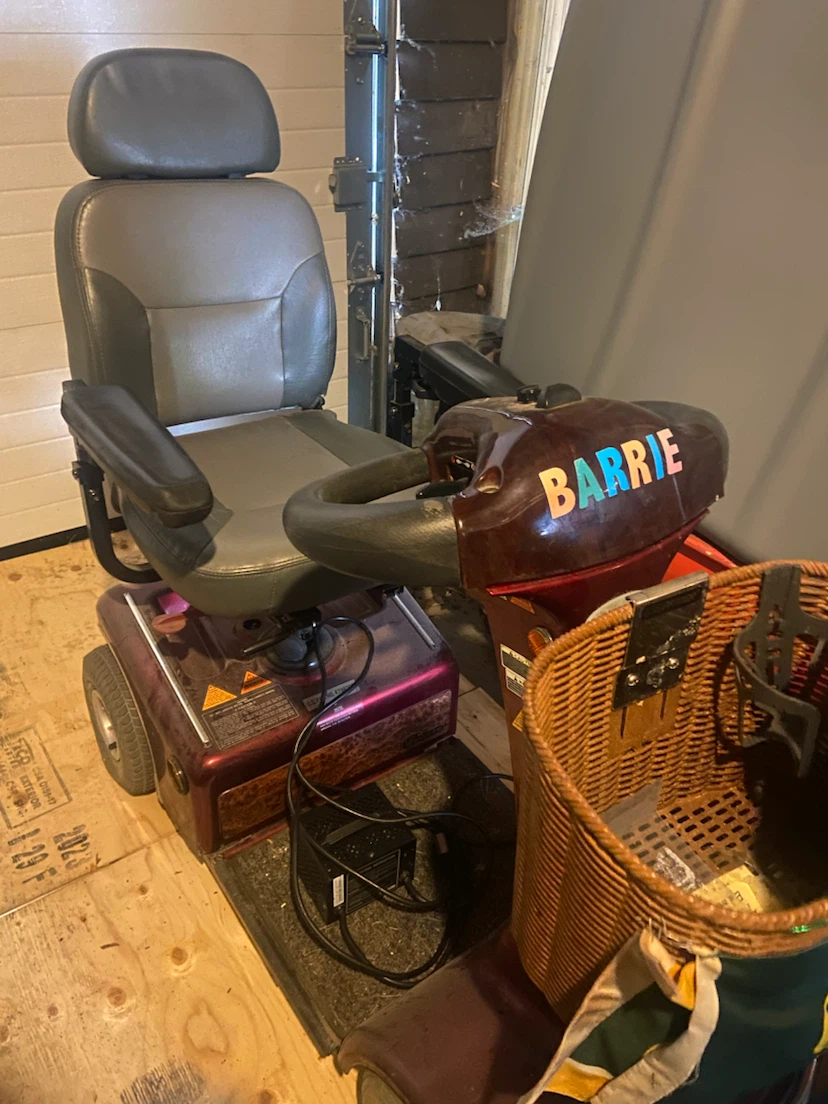 Shop rider mobility scooter in red with basket