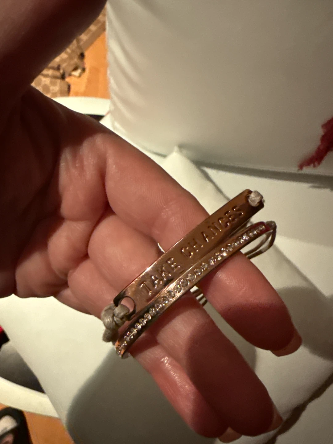 Rose gold tone bracelet with "Take Chances" engraving