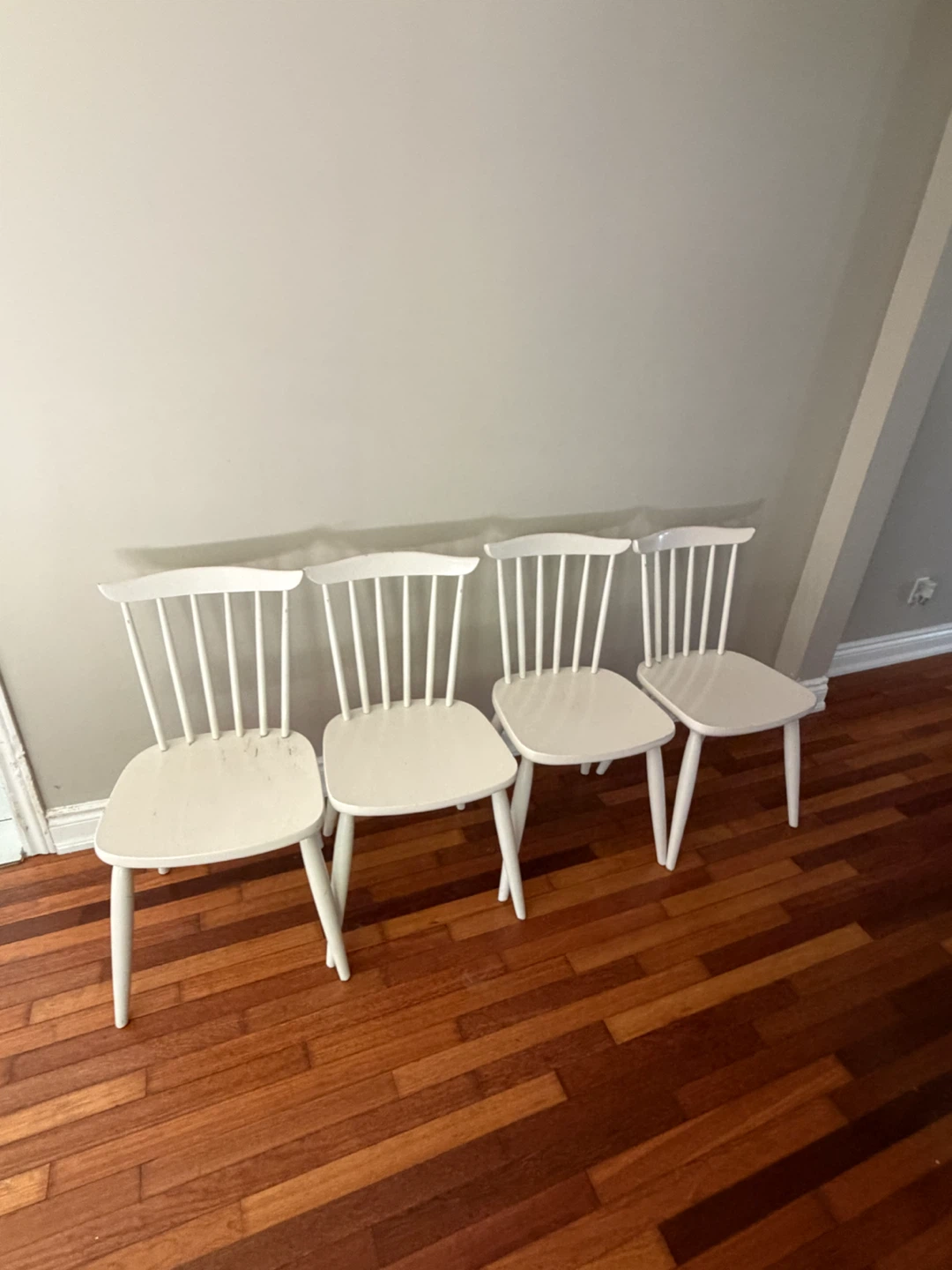 Four White Wooden Chairs