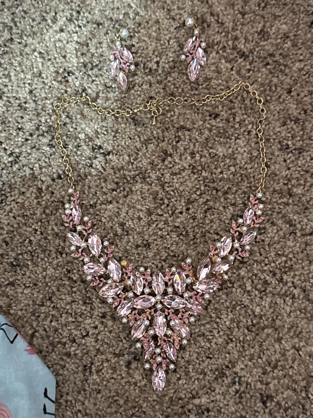 Gold tone necklace and earrings set with pink stones