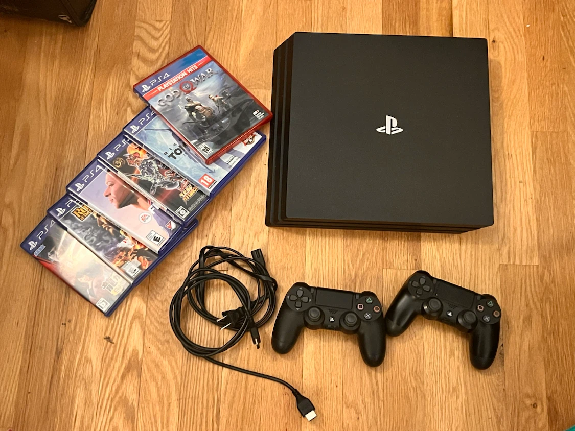 PlayStation 4 (PS4) Pro with extra controller + 6 games