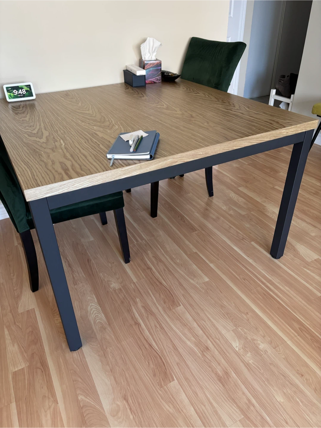 Table and 4 green velvet chairs.