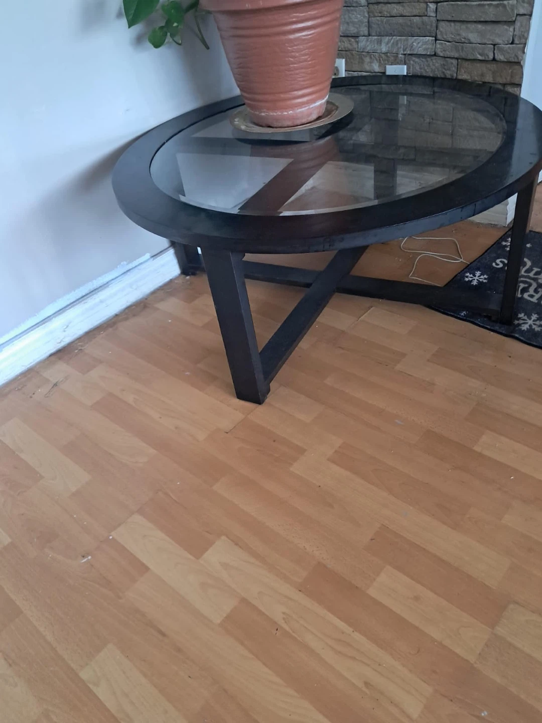 Dark Oval Coffee Table with Glass Top