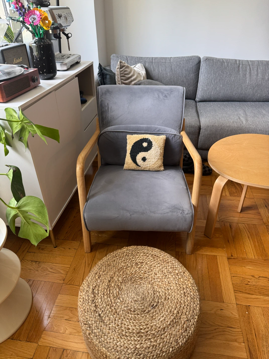Gray accent chair with wooden frame