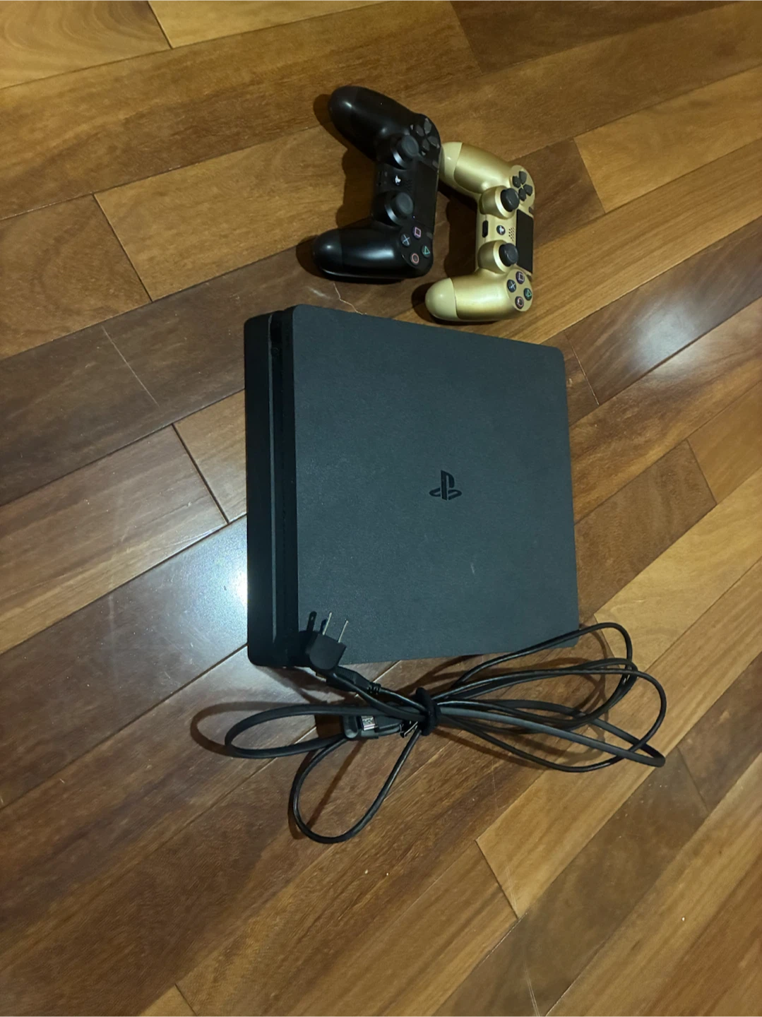 PlayStation 4 Slim Console with Two Controllers
