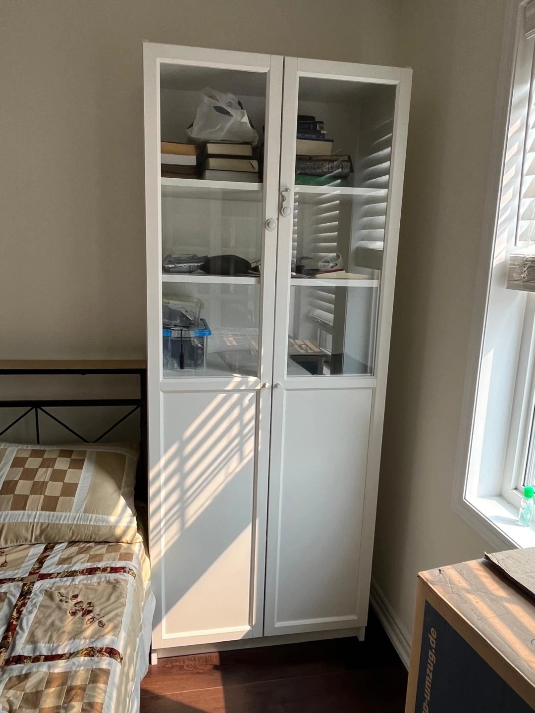 White IKEA Bookshelf with Glass Doors