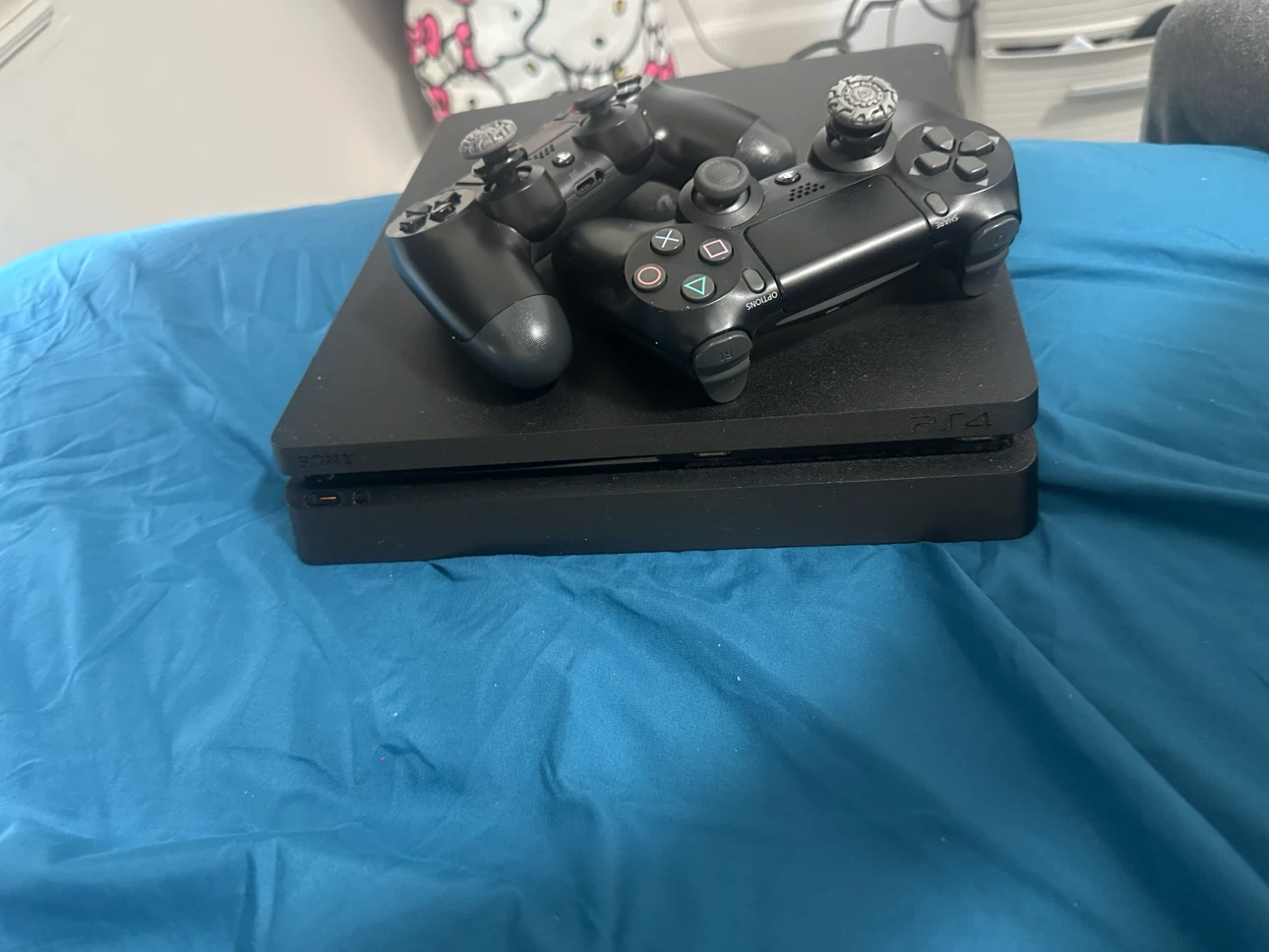 Sony PlayStation 4 Slim Console with 2 Controllers