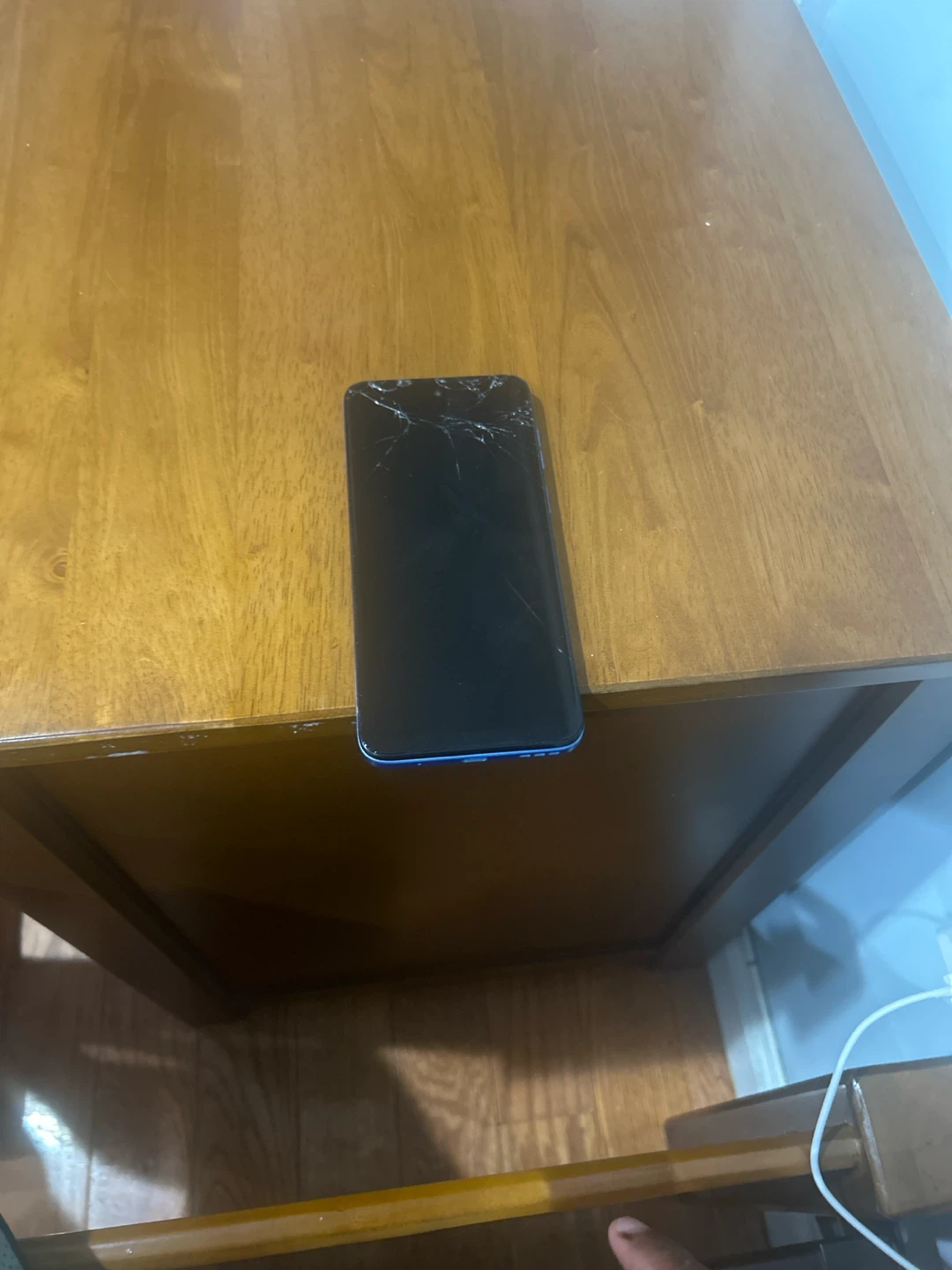 Black Smartphone with Cracked Screen