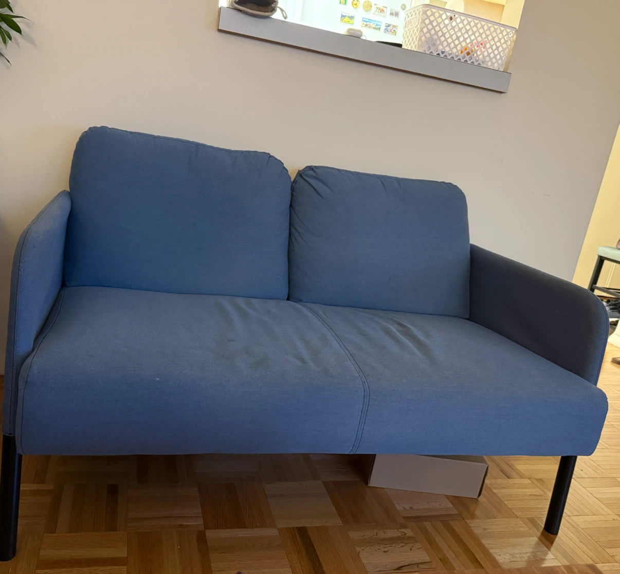 Blue two seater sofa