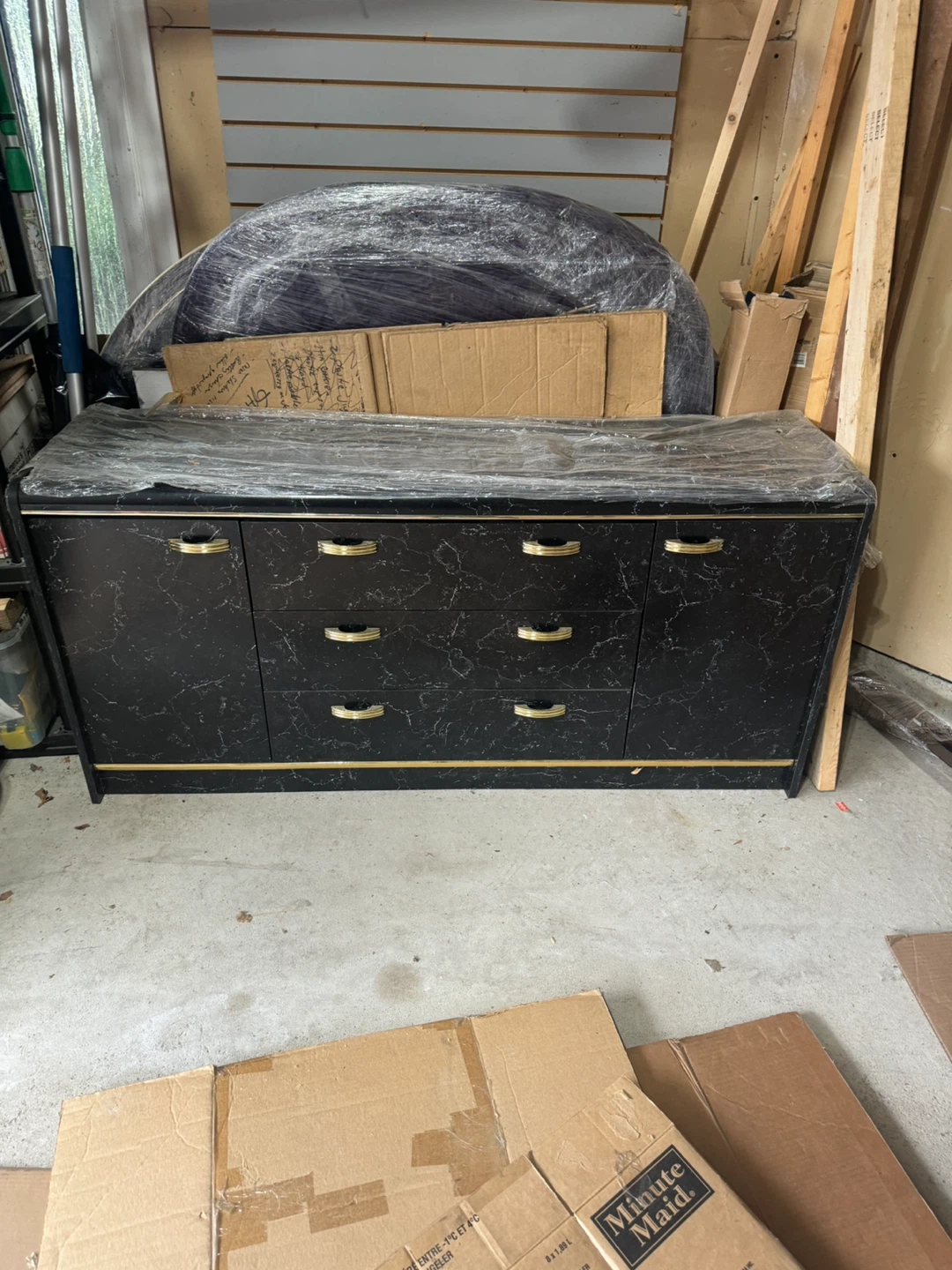 Black and Gold Dresser with Mirror and a Headboard