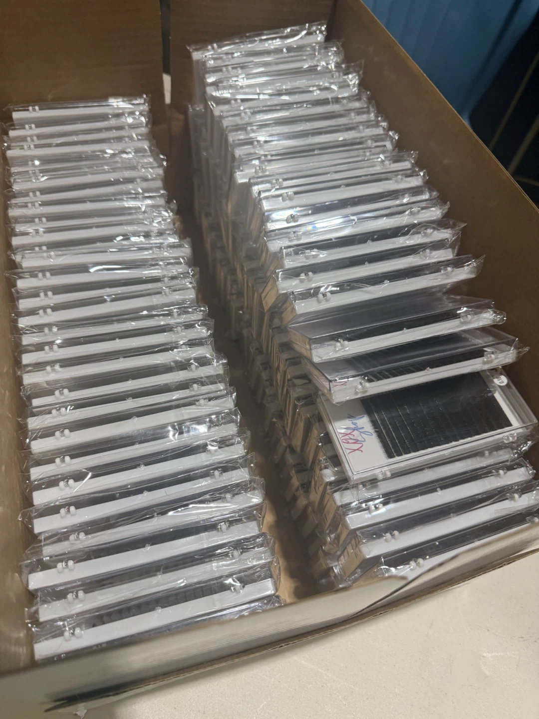120 unopened boxes of lashes.