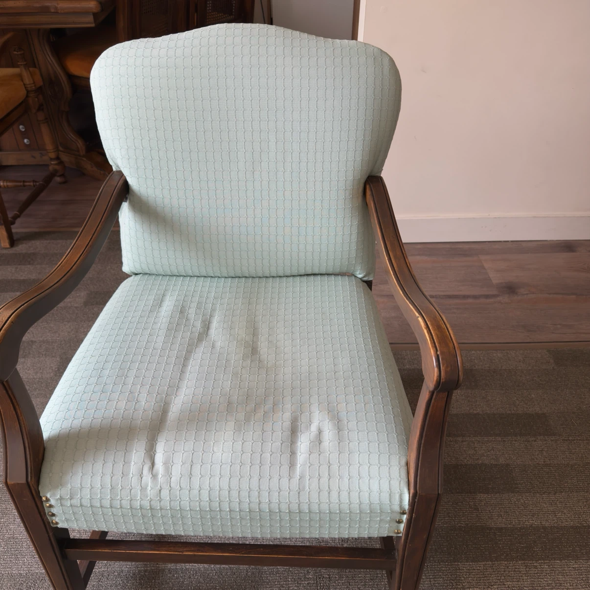 2 Armchairs with light blue textured upholstery and wooden arms