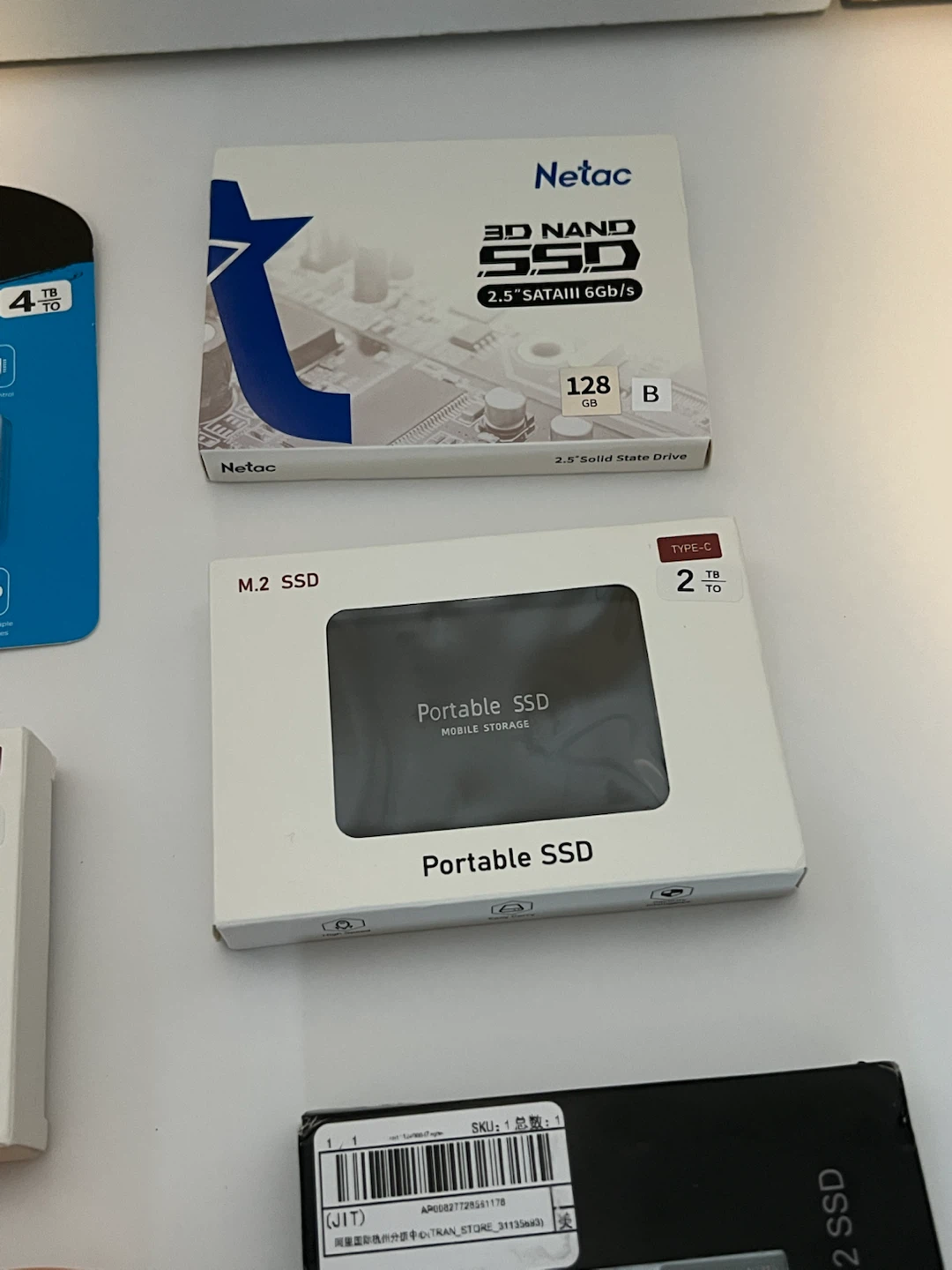 Assorted Portable SSDs, NVMe SSD, and External HDD Enclosure - photo 3