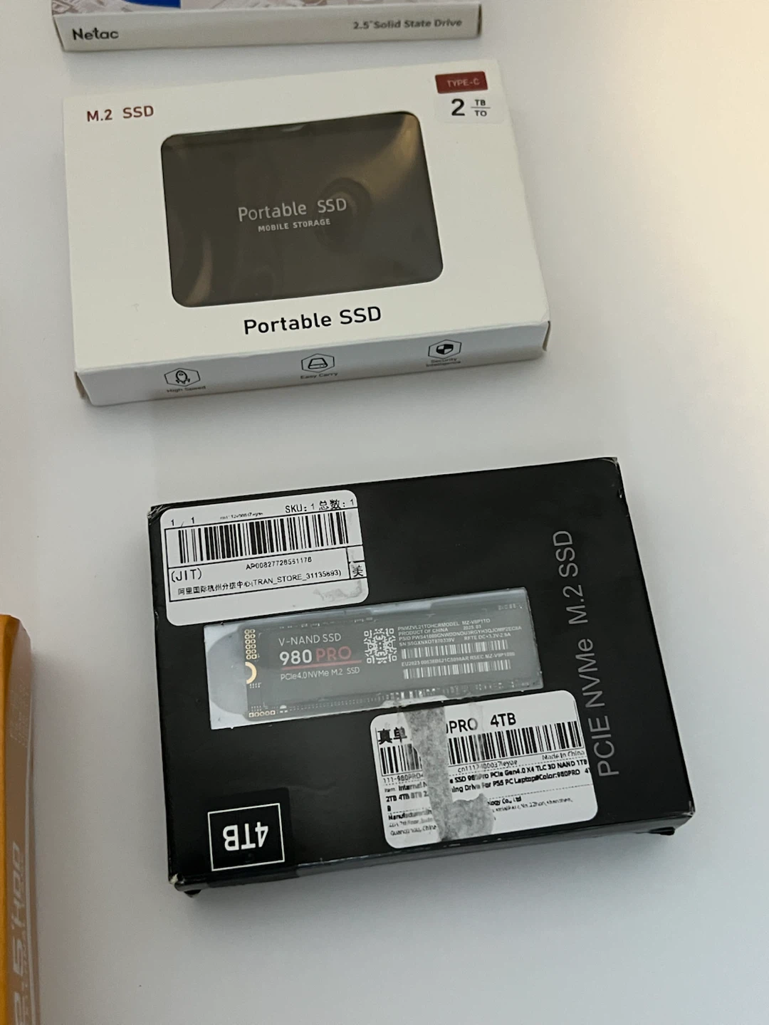 Assorted Portable SSDs, NVMe SSD, and External HDD Enclosure - photo 4
