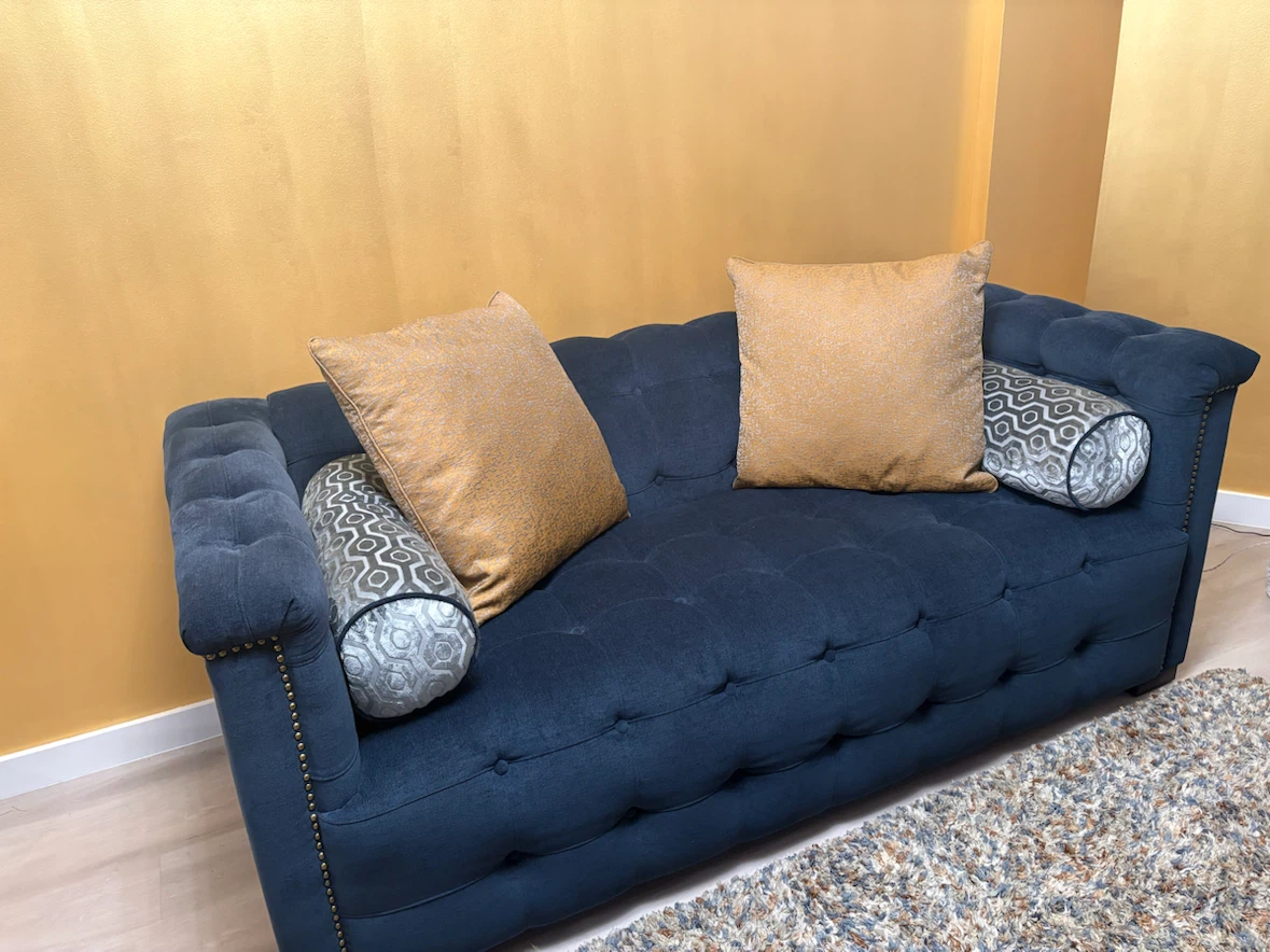 Deep Blue Tufted Sofa with Accent Pillows
