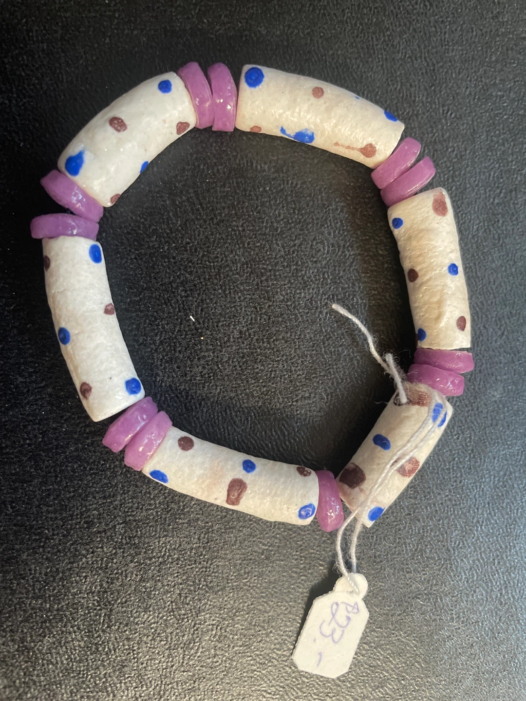 White Beaded Bracelet with Purple Accents