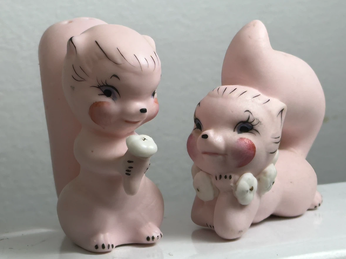 Mid century pink skunk salt and pepper