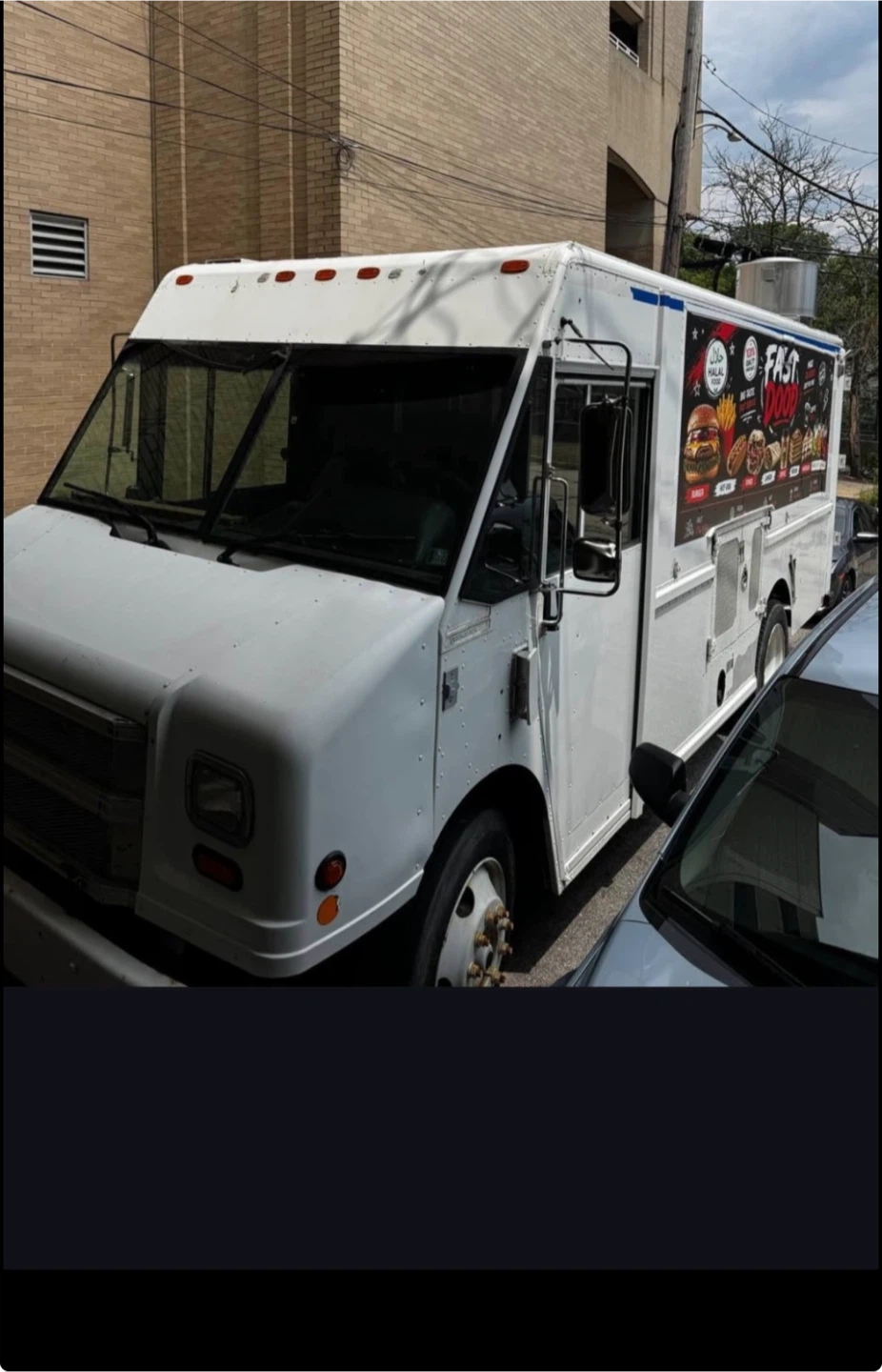 White Food Truck with "Fast Food" Graphics