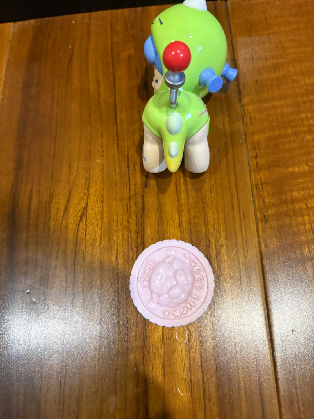 Green Character Figure with Pink Round Accessory - photo 3